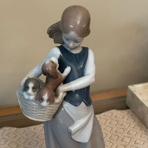 Lladró children with puppies.